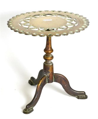 Lot 488 - A Victorian Brass Trivet, in the form of a tripod table with hinged, pierced circular top, 29cm...