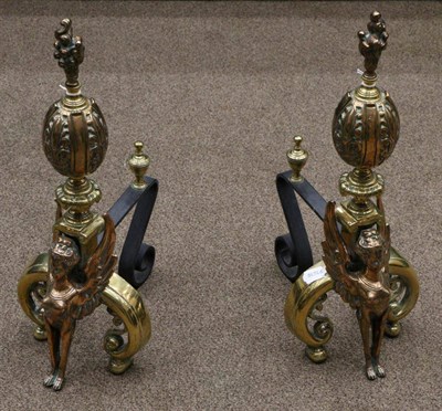 Lot 496 - A Pair of Late 19th Century Copper and Brass Andirons, modelled as griffins supporting foliate...