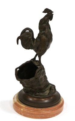 Lot 526 - A Bronze Match Holder, circa 1900, modelled as a cockerel on a basket, signed A.CAIN, 20cm high