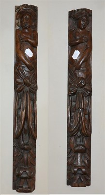 Lot 539 - A Pair of 17th Century Oak Caryatids, carved as Adam and Eve above drapery and leaves, 64cm high