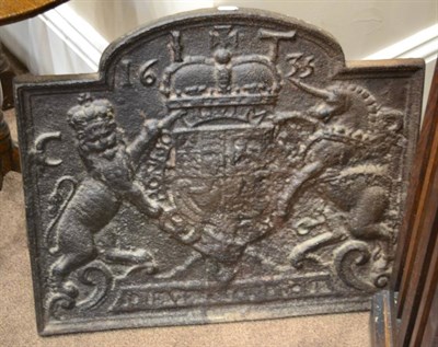 Lot 540 - A Cast Iron Fire Back, of arched rectangular form cast with the arms of Charles I and the date...