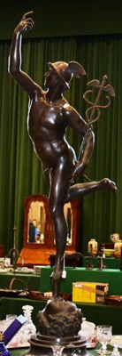 Lot 545 - After Giambologna: A Bronze Figure of Mercury, on a circular socle, 198cm high