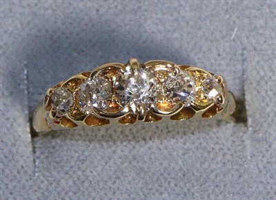 Lot 591 - A Diamond Five Stone Ring, graduated old cut diamonds in a carved setting, total estimated...