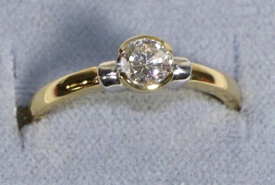 Lot 593 - An 18 Carat Gold Solitaire Diamond Ring, a round brilliant cut diamond in a half rubbed over...