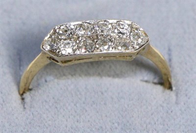 Lot 595 - A Diamond Plaque Ring, grain set old cut diamonds to a canted plaque, to knife edge shoulders,...