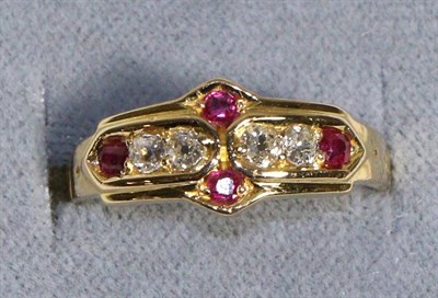 Lot 598 - An 18 Carat Gold Diamond and Ruby Ring, four old cut diamonds spaced by round cut rubies in a...