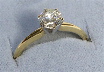 Lot 599 - An 18 Carat Gold Solitaire Diamond Ring, a round brilliant cut diamond in a claw setting, to...