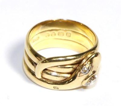 Lot 602 - An 18 Carat Gold Diamond Snake Ring, a coiled snake as three bands with old cut diamond set...