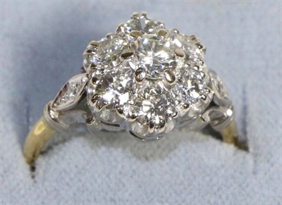 Lot 609 - A Diamond Cluster Ring, seven round brilliant cut diamonds in claw settings, to forked diamond...