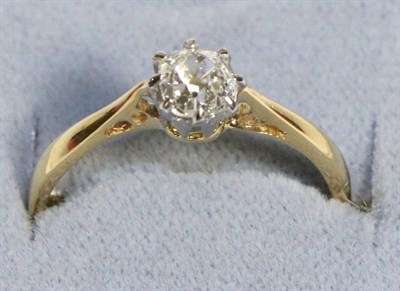 Lot 610 - A Solitaire Diamond Ring, an old cushion cut diamond in a claw setting, to knife edge...