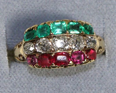 Lot 625 - An Emerald, Diamond and Ruby Ring, as three gem set bands, to carved scroll shoulders, total...