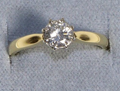 Lot 627 - An 18 Carat Gold Solitaire Diamond Ring, a round brilliant cut diamond in a claw setting, to...