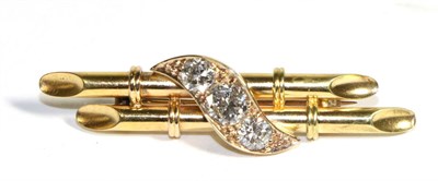 Lot 633 - A Diamond Scroll Bar Brooch, a central scroll set with three graduated old cut diamonds, to a...