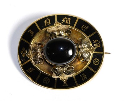 Lot 641 - A Victorian Banded Agate and Black Enamel Mourning Brooch, an oval cabochon black agate in a rubbed