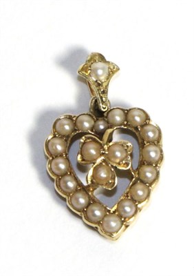 Lot 644 - A Seed Pearl Heart Pendant, a central clover motif within a heart frame, to a seed pearl set...