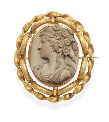 Lot 649 - A Lava Cameo Brooch, carved in high relief with the bust of Flora, in a fancy rope frame, with...