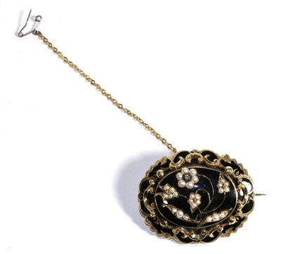 Lot 650 - A Victorian Pearl, Diamond and Black Enamel Mourning Brooch, an oval centre with applied seed pearl