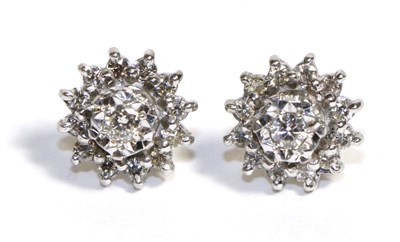 Lot 670 - A Pair of Diamond Cluster Earrings, a round brilliant cut diamond in an illusion setting within...