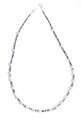 Lot 679 - A Sapphire and Cultured Pearl Necklace, graduated faceted sapphire beads spaced at intervals by...