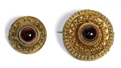 Lot 685 - A Victorian Garnet Target Brooch, a round cabochon garnet in a rubbed over setting within a...