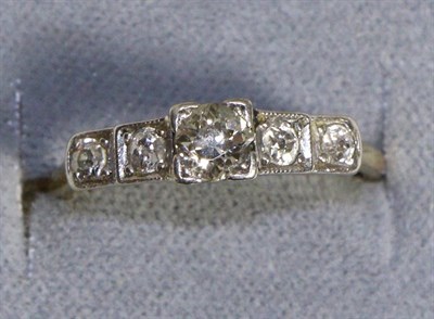 Lot 689 - A Diamond Five Stone Ring, an old cut diamond in a square claw setting, flanked by further old...