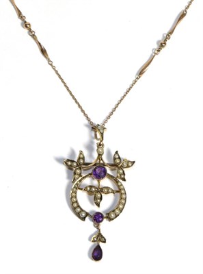 Lot 698 - An Art Nouveau Amethyst and Seed Pearl Brooch/Pendant Necklace, two graduated round cut amethyst in