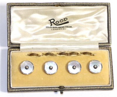 Lot 703 - A Cased Set of Four Dress Buttons, a seed pearl within a border of black enamel to...