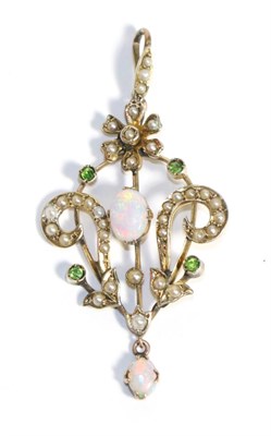 Lot 706 - An Art Nouveau Opal, Demantoid Garnet and Seed Pearl Pendant, an oval cabochon opal to a scroll...