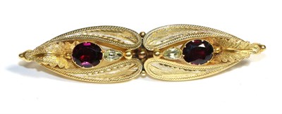 Lot 707 - A Victorian Garnet and Chrysoberyl Brooch, two oval cut garnets and two pear cut chrysoberyl in...