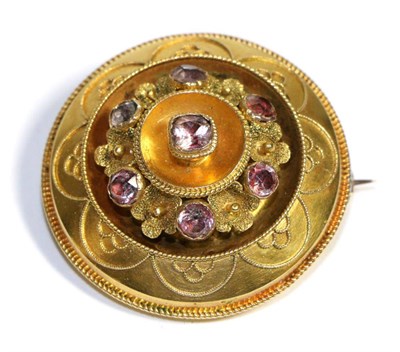 Lot 731 - A Victorian Target Brooch, a central foil backed paste within a domed frame with rope detail and an