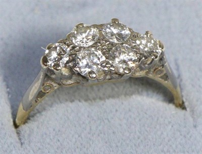 Lot 742 - A Diamond Navette Cluster Ring, six round brilliant cut diamonds in milgrain settings, to knife...