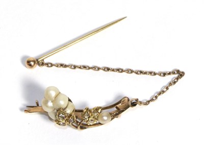 Lot 744 - A Baroque Pearl and Diamond Brooch, a scroll bar with rose cut diamond leaf clusters with...