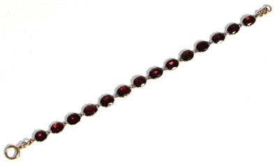 Lot 747 - A Georgian Flat Cut Garnet Bracelet, oval garnets in closed back collet settings, length 19cm