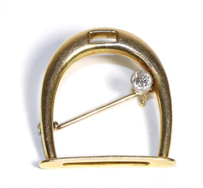 Lot 752 - A Diamond Stirrup Brooch, an old cut diamond in a milgrain setting to a stirrup frame,...