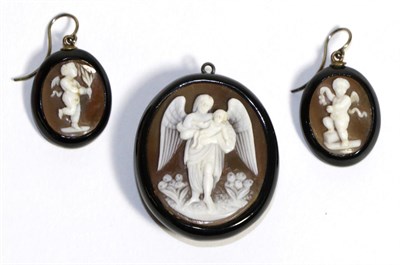 Lot 764 - A Jet and Cameo Pendant and Earrings, the pendant carved depicting an angel holding an infant,...