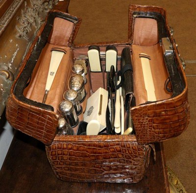 Lot 788 - A Victorian Gentleman's Crocodile Travelling Case, late 19th century, with a Betjemann's Patent...