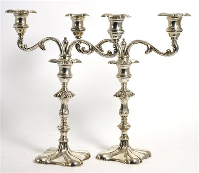 Lot 801 - A Pair of Edwardian Silver Two Light Candelabra, R & W Sorley, London 1902, the foliate scroll...