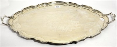 Lot 823 - A Large Edwardian Silver Twin Handled Tray, Goldsmiths & Silversmiths, London 1909, of shaped...