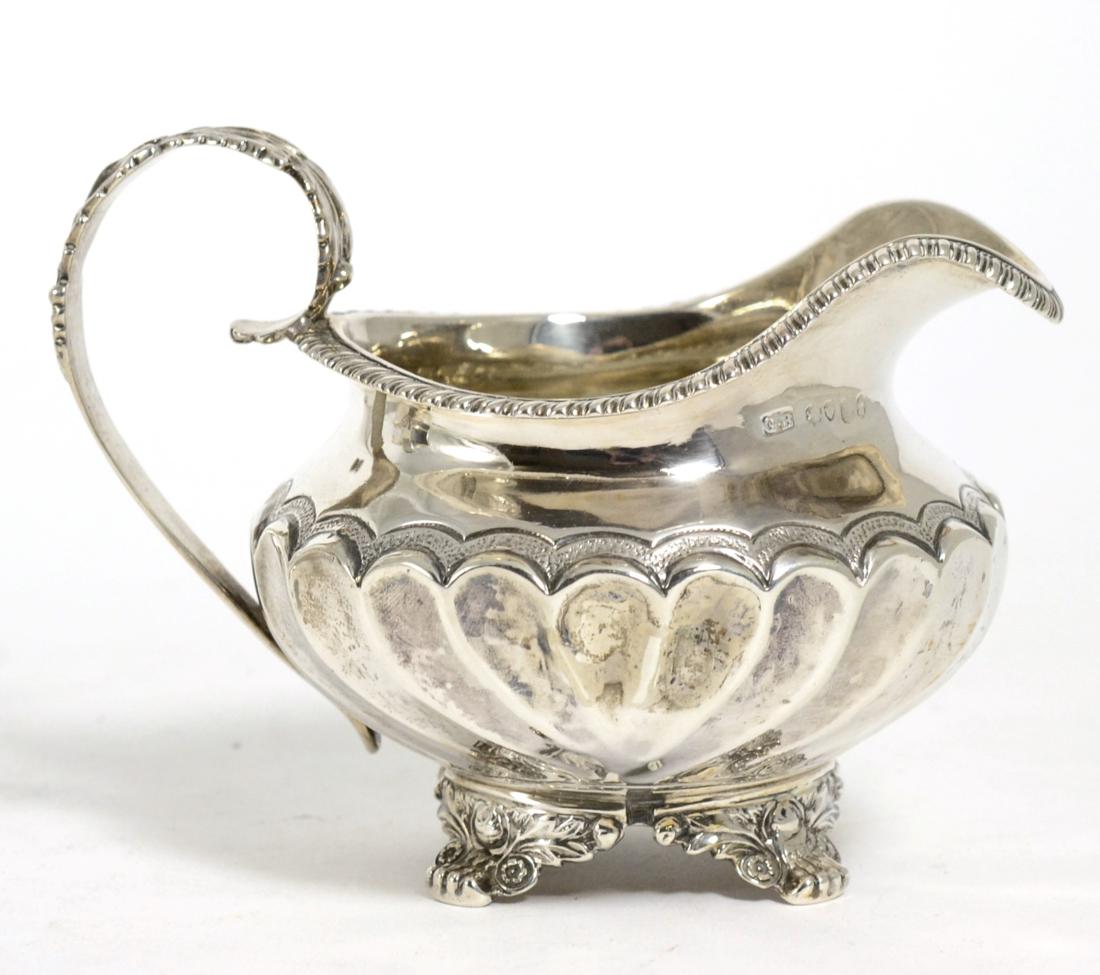 Lot 842 - A George IV Silver Cream Jug, George Burrows, London 1825, squat circular with gadroon border,...