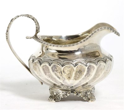 Lot 842 - A George IV Silver Cream Jug, George Burrows, London 1825, squat circular with gadroon border,...