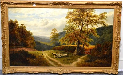 Lot 1024 - William Mellor (1851-1931) Shepherdess and sheep on a track in a wooded landscape Signed, oil...