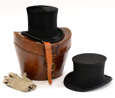 Lot 1041 - A Black Silk Top Hat, in leather case, A Collapsible Top Hat Labelled GA Dunn &amp; Co,...