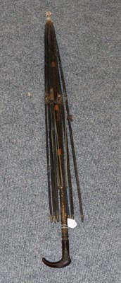 Lot 1055 - A Parasol with Bovine Horn Handle of foliate design, and brass mounts