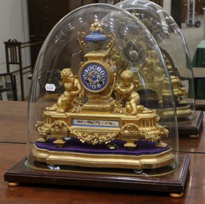 Lot 1062 - A Gilt Metal and Porcelain Mounted Striking Mantel Clock, circa 1890, surmounted by an urn...