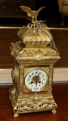 Lot 1068 - A Gilt Brass Striking Mantel Clock, early 20th century, architectural form case with shell and...