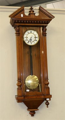 Lot 1069 - A Walnut Veneered Quarter Striking Wall Clock, circa 1900, fluted side columns, front and side...