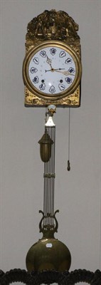 Lot 1083 - A French Comptoise Striking Wall Clock, late 19th century, brass embossed mounted fret, enamel...