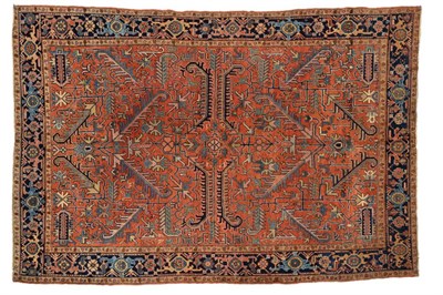 Lot 1100 - Heriz Carpet Iranian Azerbaijan, circa 1910 The rust field of angular vines enclosed by deep indigo