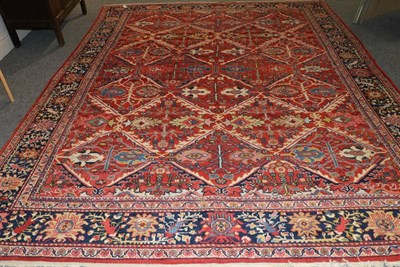 Lot 1103 - Sultanabad Carpet West Iran, circa 1920 The tomato red field of diamond lattice design...