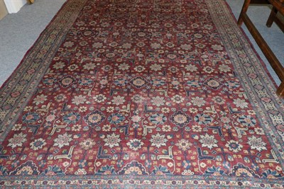 Lot 1104 - Tabriz Carpet Iranian Azerbaijan, circa 1920 The abrashed raspberry field of Kuba design...